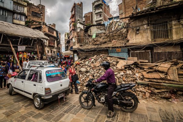 A bicycle passes an earthquake wreckage in Nepal